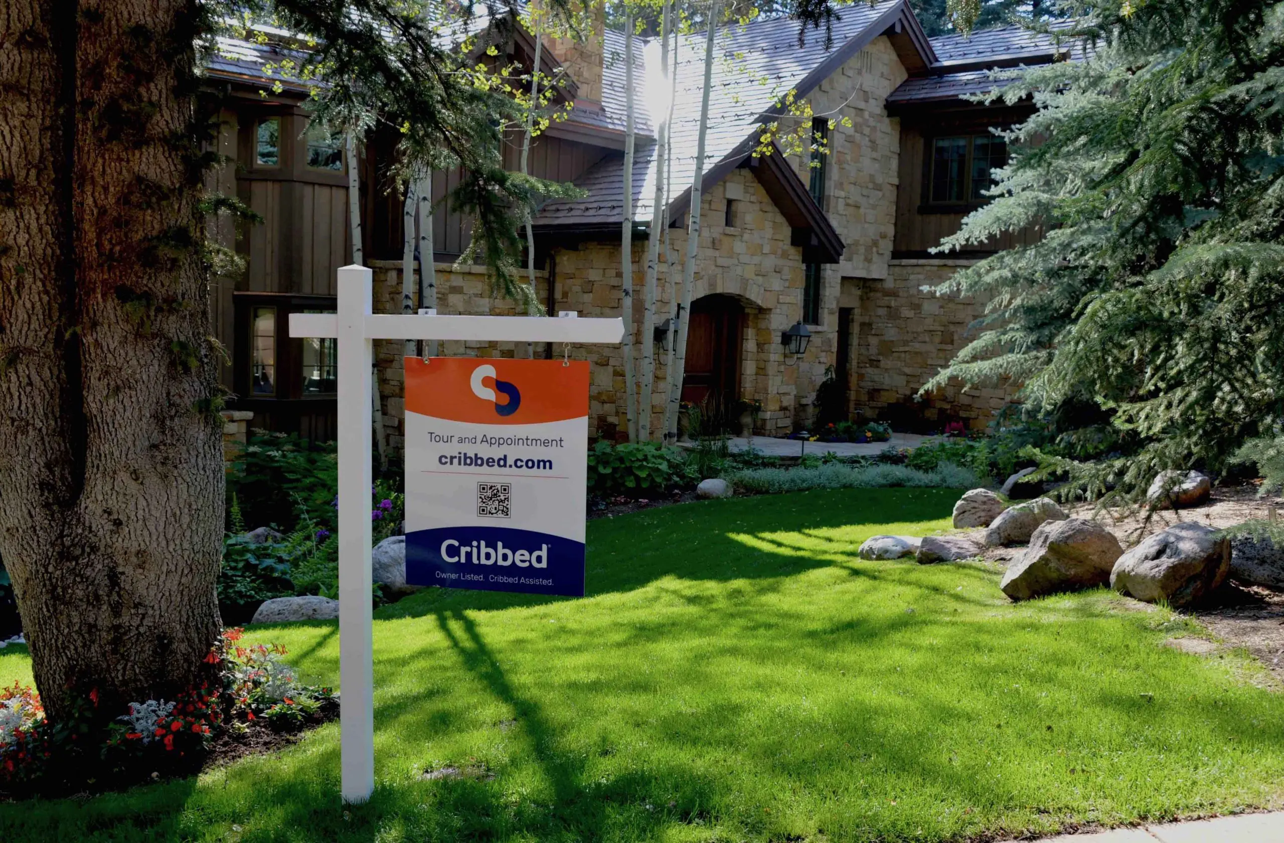 Sign-on-stone-house-in-Vail-scaled