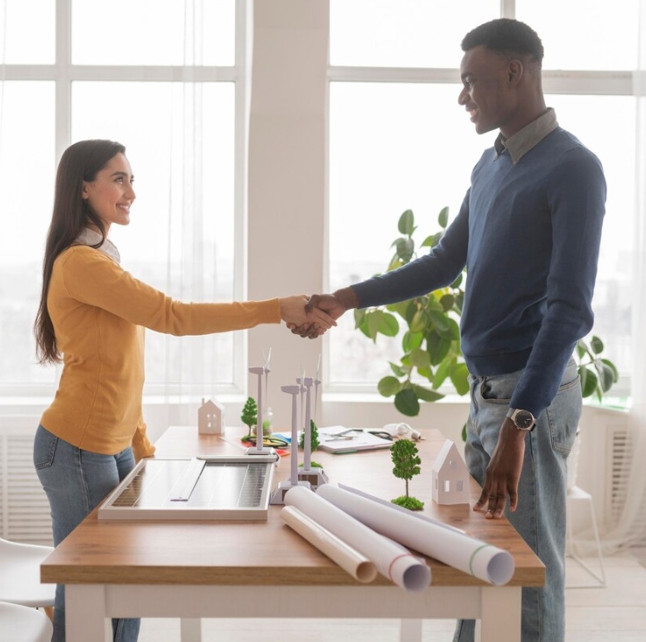 Two people shaking hands to negotiate offers